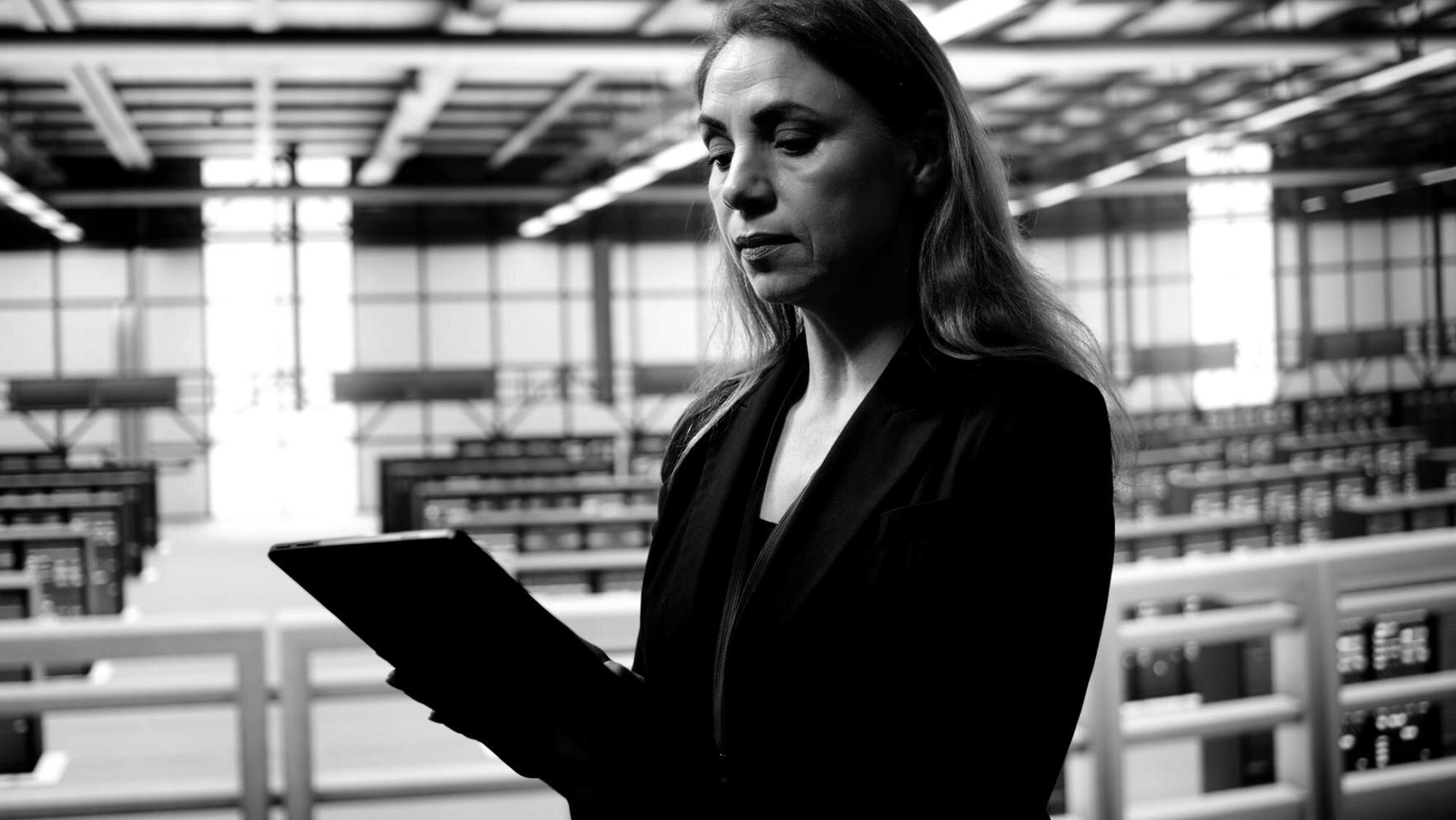 Students working on blockchain programming projects in modern learning environment